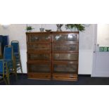 A pair of oak Globe Wernicke bookcases each with four sections.
