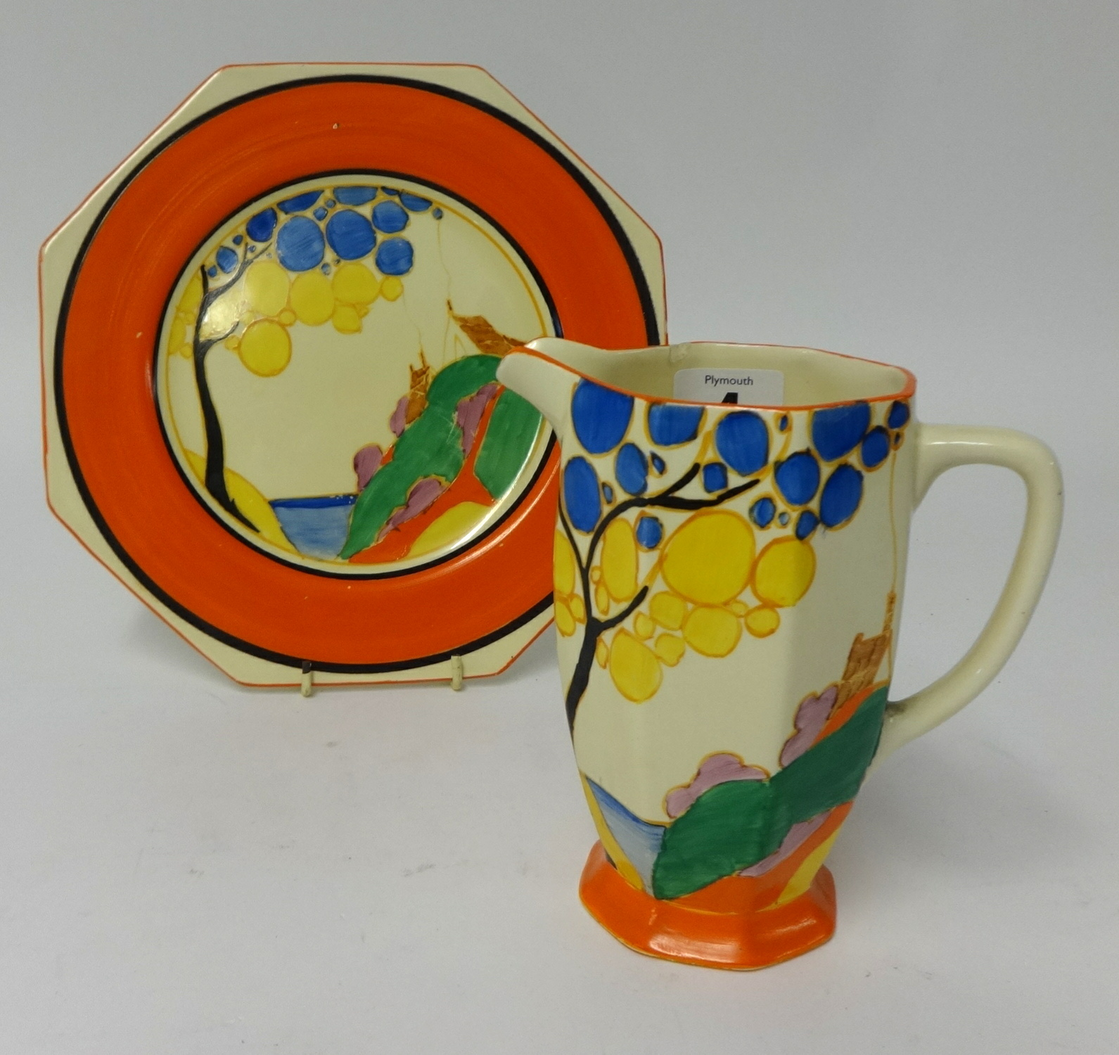 Clarice Cliff, a Fantasque jug, height 15cm (small chip to rim), together with a similar patterned