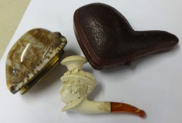 A miniature antique carved pipe of a figure head, cased, length of case 8cm together with a 19th