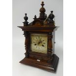 Victorian stained wood mantel clock with eight day chiming movement, height 48cm.