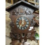 Three 20th Century cuckoo clocks, Acctim modern wall clock and Hermle iron framed wall clock (5).