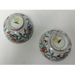 A pair of Chinese porcelain bowls, decorated with stylised branches and flowers, diameter 16cm