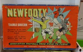 A table soccer game and a collection of various boxed diecast promo models including Matchbox.