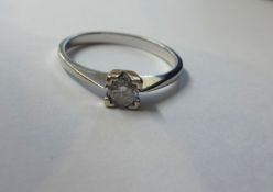 A 18k white gold diamond solitaire ring.