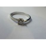 A 18k white gold diamond solitaire ring.