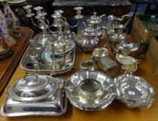 A quantity of silver plated wares including tea services, trays, candelabra, sugar castors, entre