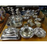 A quantity of silver plated wares including tea services, trays, candelabra, sugar castors, entre