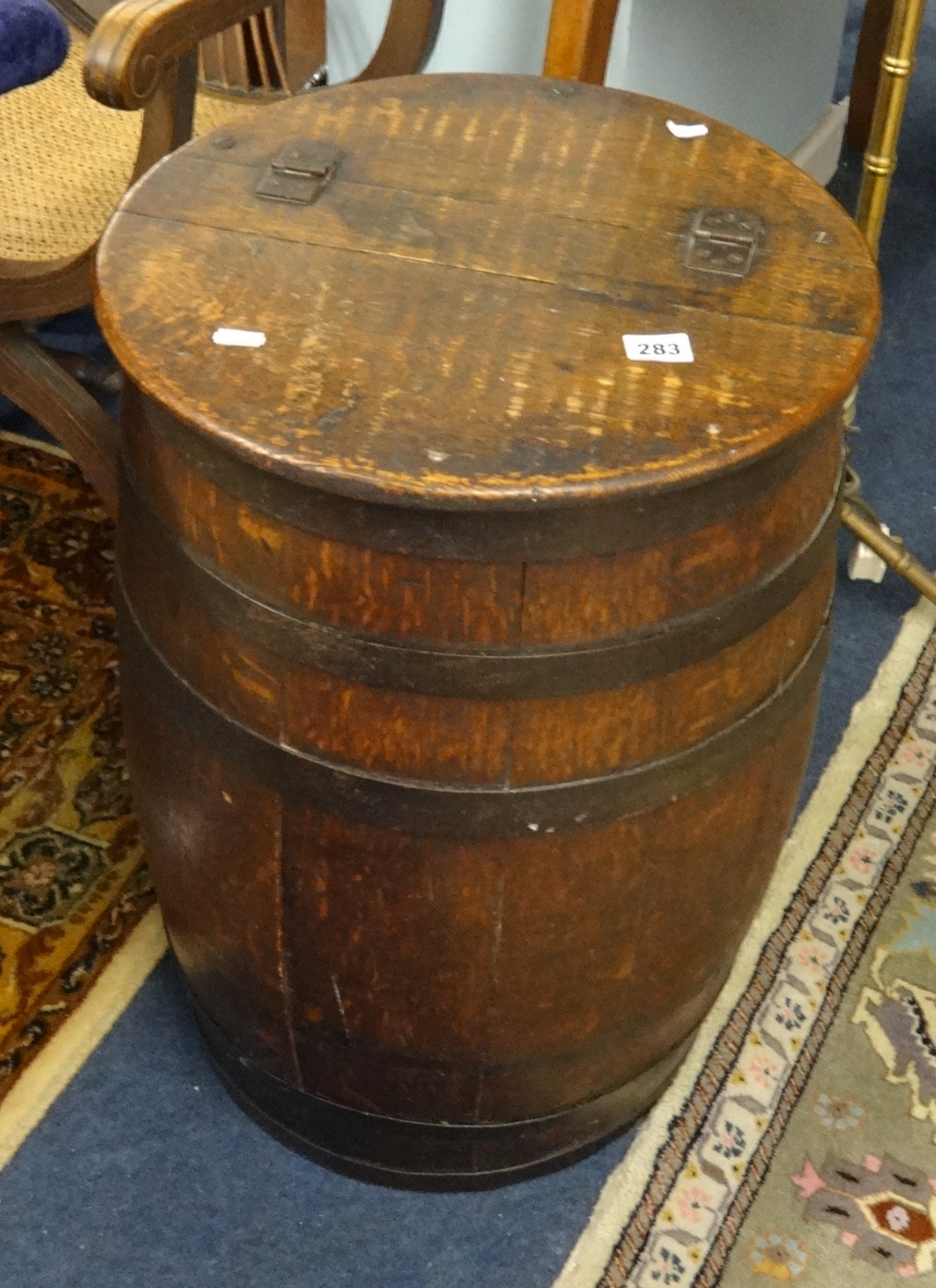 An antique oak and coopered barrel or stick stand with lid.