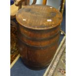 An antique oak and coopered barrel or stick stand with lid.
