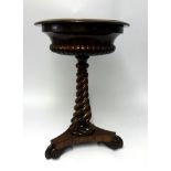 A William IV rosewood Teapoy, with a fitted interior twist pedestal base, diameter 50cm.