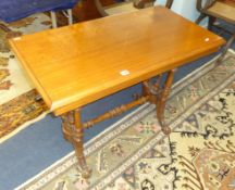A mahogany side table with stretcher base