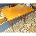 A mahogany side table with stretcher base