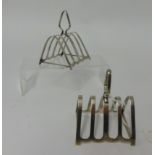 A pair of silver four division toast racks together with a quantity of silver plated wares.