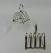 A pair of silver four division toast racks together with a quantity of silver plated wares.