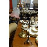 A rising brass table lamp with glass shade and a metal candelabra (2).