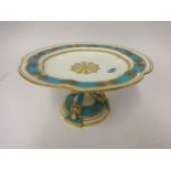 A 19th Century porcelain turquoise and gilt comport, height 13cm.