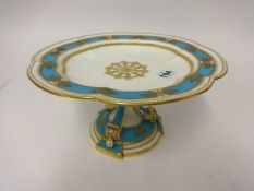 A 19th Century porcelain turquoise and gilt comport, height 13cm.