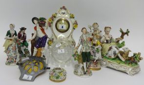 A collection of porcelain figurines, mainly German of antique style also a small carved black forest