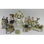 A collection of porcelain figurines, mainly German of antique style also a small carved black forest