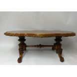 A good burr walnut coffee table with carved walnut stretcher base, width 128cm, height 46cm.