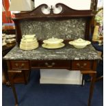 A mahogany and marble top washstand