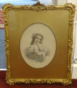 A pair of Victorian hand embellish portraits of children in gilt gesso frames and oval gilt