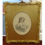 A pair of Victorian hand embellish portraits of children in gilt gesso frames and oval gilt