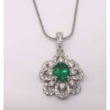 A pretty emerald and diamond pendant and chain.