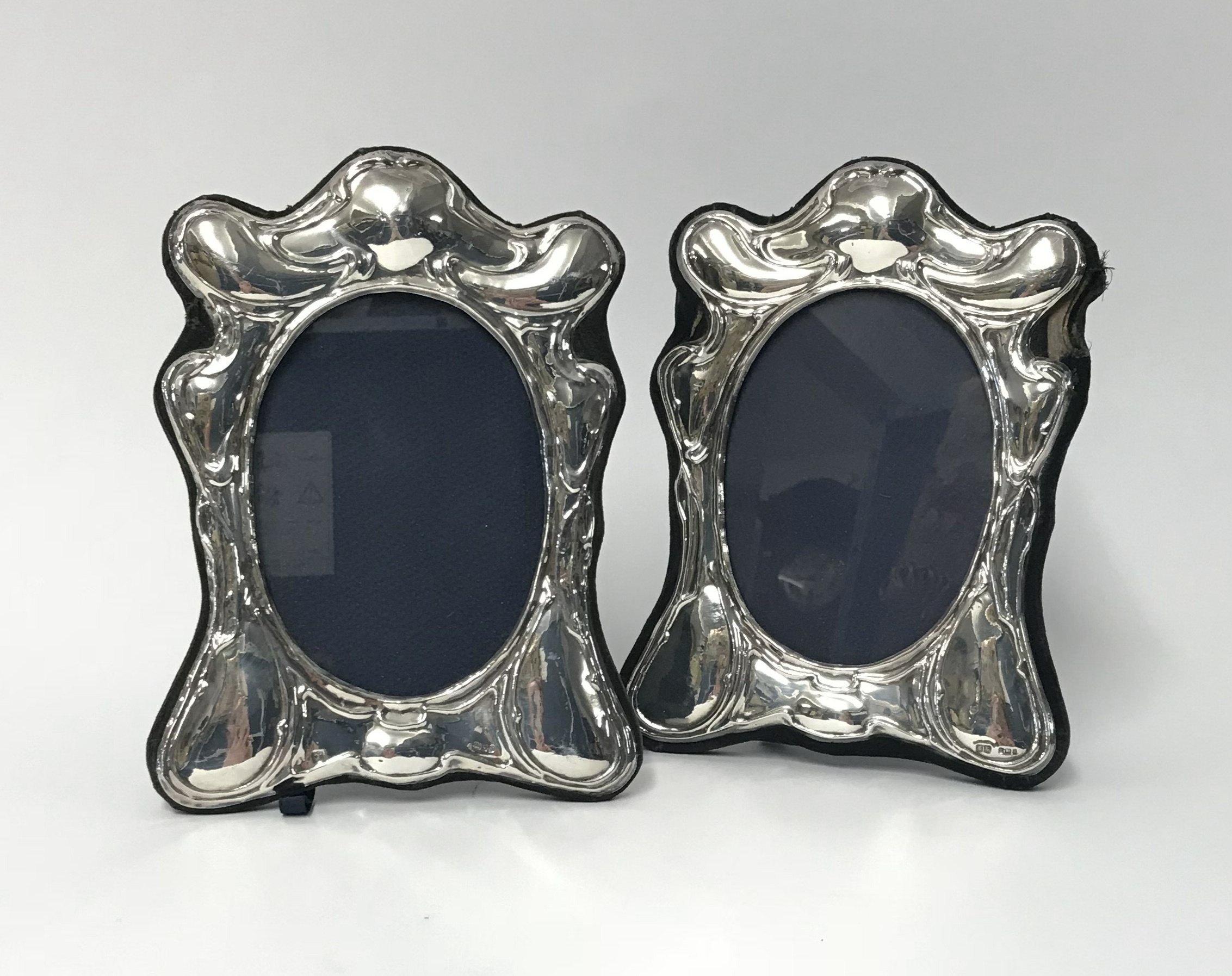 A pair of modern silver photo frames circa 1987, maker S.S, height 20cm, width 14cm (2).