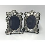 A pair of modern silver photo frames circa 1987, maker S.S, height 20cm, width 14cm (2).