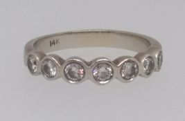 An 14K diamond seven stone ring.