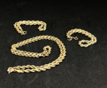 A 9ct gold necklace and two smaller similar bracelets, approx 10gms.