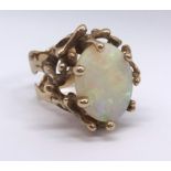An impressive 9ct dress ring set with an oval opal (approx 4.86cts), finger size M, together with