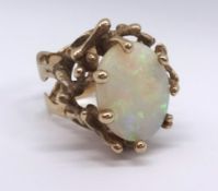 An impressive 9ct dress ring set with an oval opal (approx 4.86cts), finger size M, together with