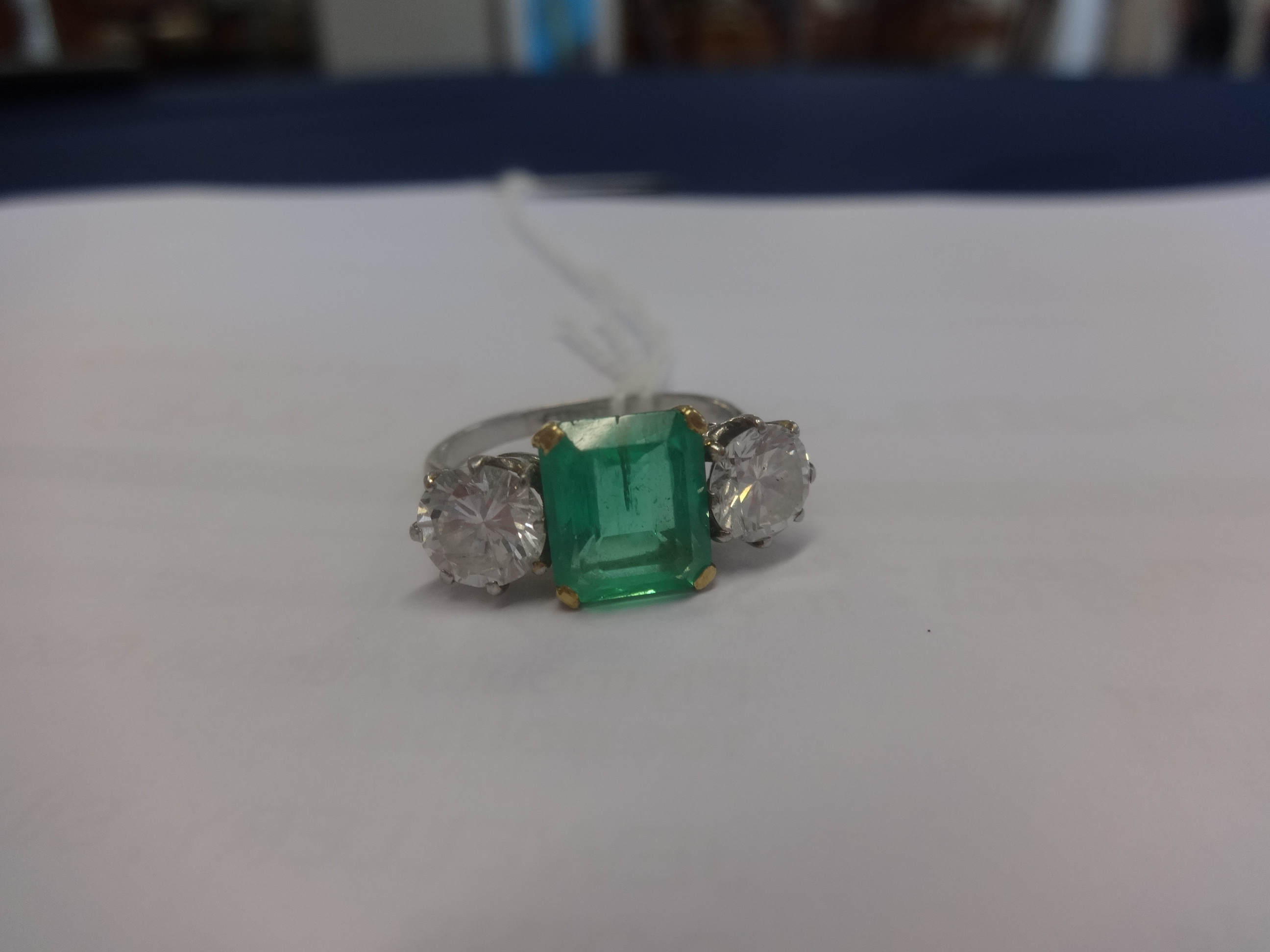 A platinum, emerald and diamond three stone ring, the centre stone measuring approx 9mm x 7mm, the - Image 4 of 5