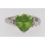 A modern peridot ring set in white gold stamped 9k, ring size O.