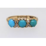 An 18ct three stone turquoise ring set with four small diamonds, ring size N.