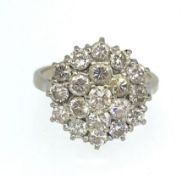 A 18ct diamond cluster ring, setting diameter 16mm, ring size Q.