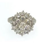 A 18ct diamond cluster ring, setting diameter 16mm, ring size Q.