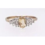 A 9ct diamond and yellow stone fancy ring, ring size N.