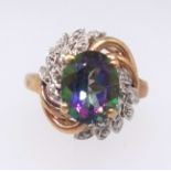 A mystic fire topaz ring, approx 3cts, set with further diamonds in