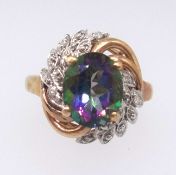 A mystic fire topaz ring, approx 3cts, set with further diamonds in