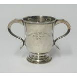 A Geo V, silver twin handled trophy, approx 9.58 oz, height 11cm, by Carrington & Co, London,