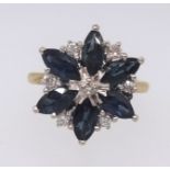An 18ct sapphire and diamond flower style ring, ring size M.