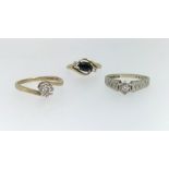 An 18ct diamond set dress ring together with a 9ct and diamond dress ring also a 9ct three stone