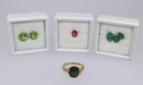 Various loose stones including red spinel, peridot and emerald together with a 9ct gold dress ring.