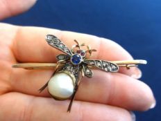 An antique 'bug' brooch, set with diamonds, rubies, a sapphire and a baroque pearl, in a yellow