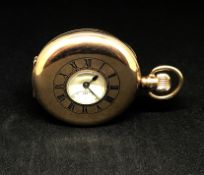 A 9ct gold half hunter keyless pocket watch, with plain back plate, the dial with roman numerals and