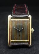 Cartier, a ladies Must de silver gilt manual wind wristwatch.