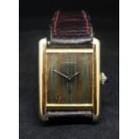 Cartier, a ladies Must de silver gilt manual wind wristwatch.